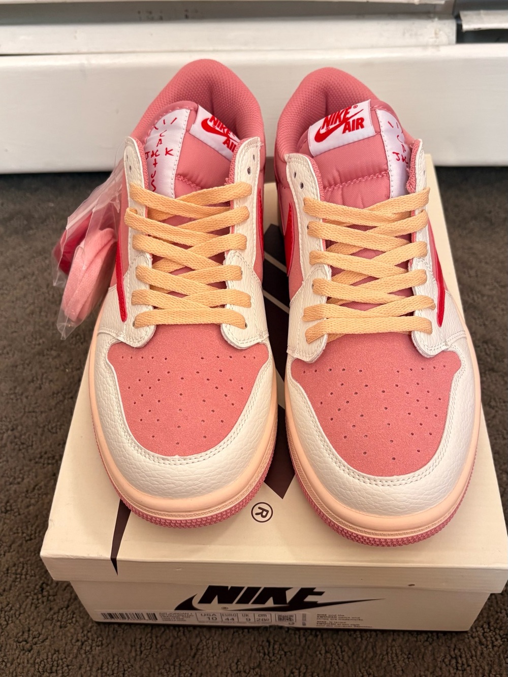 Travis Scott Pink and Cream Low-Top Sneakers